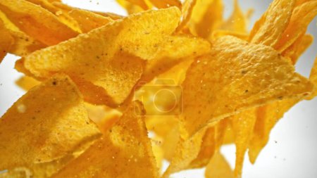Photo for Freeze Motion of Falling Fried Tortilla Chips. Abstract Junk Food Background. - Royalty Free Image