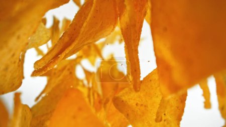 Photo for Freeze Motion of Falling Fried Tortilla Chips. Abstract Junk Food Background. - Royalty Free Image