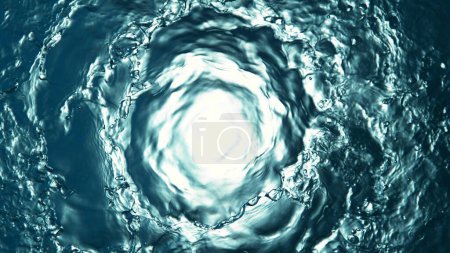 Téléchargez les photos : Texture of splashing water surface, top shot, tunnel shape. Abstract beverage background, freeze motion. - en image libre de droit