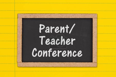 Photo for Parent Teacher Conference message on a chalkboard on bright yellow lined paper - Royalty Free Image