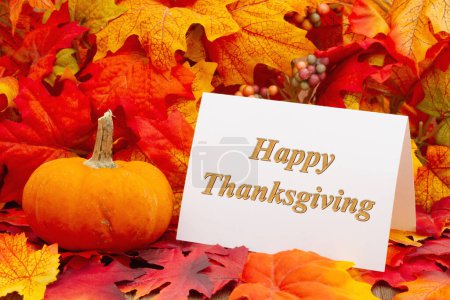 Photo for Happy Thanksgiving greeting card with fall leaves and a pumpkin - Royalty Free Image