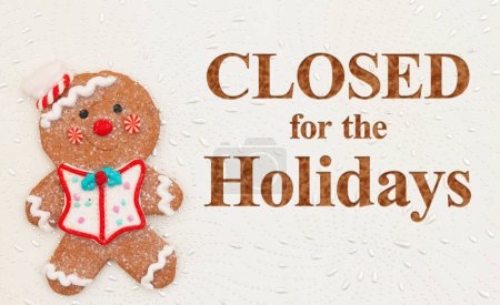 Closed for the Holidays message with cute gingerbread man on textured white