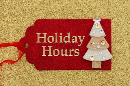 Holiday Hours message on a red holiday gift tag with a Christmas tree on gold glitter paper