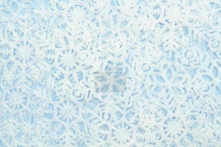 Foto de White and blue snowflakes winter season background for your winter or seasonal message - Imagen libre de derechos