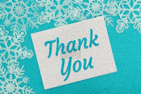 Photo for Thank you silver greeting card with white snowflakes on teal glitter - Royalty Free Image