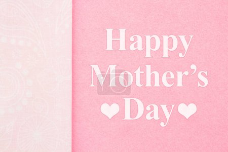 Foto de Happy Mothers Day greeting on pink with ribbon with swirls - Imagen libre de derechos