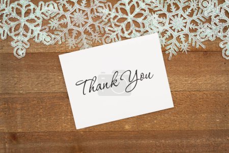 Photo for Thank you greeting card with white snowflakes on weathered wood - Royalty Free Image