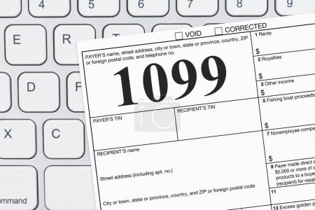 Photo for Doing your taxes as a freelancer with a USA 1099 form on a keyboard - Royalty Free Image