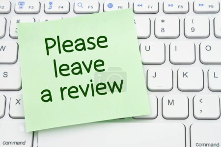 Téléchargez les photos : Please leave a review sticky note on a keyboard - en image libre de droit