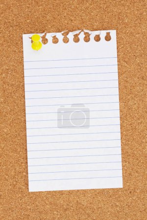 Photo for Blank ruled paper with a pushpin on a corkboard for your message or information - Royalty Free Image
