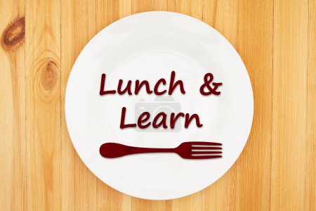 Lunch and Learn message on a plate with a fork on wood table
