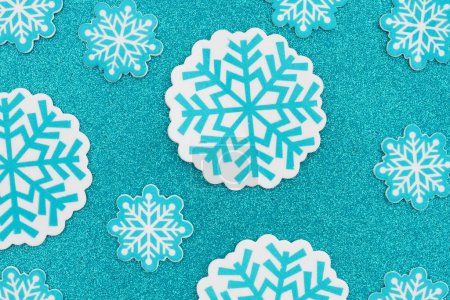 Foto de Lots of blue snowflakes winter background for your season or cold message - Imagen libre de derechos