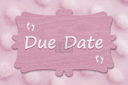 Photo for Due Date message on a sign with baby pink fleece material textured - Royalty Free Image