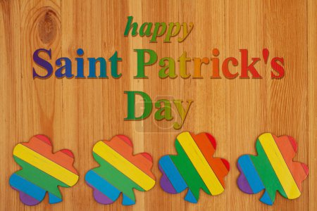 Photo for Happy Saint Patricks Day greeting with rainbow shamrocks on wood for saint patricks day - Royalty Free Image