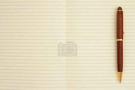 Ruled line journal paper page with pen background for you writing or journaling message