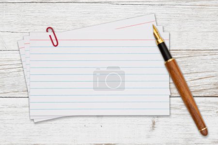 Photo for Retro white paper index cards with pen on weathered wood with copy space for your message - Royalty Free Image