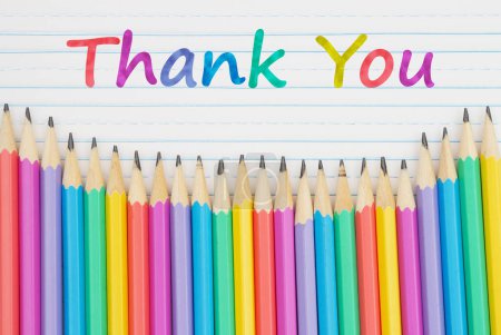 Photo for Thank You message with color pencils on vintage ruled line notebook paper for you education or school message - Royalty Free Image