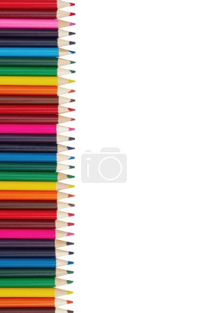Photo for Colored pencil crayons school background isolated on white for your education message - Royalty Free Image