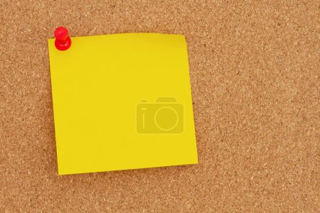 Photo for Blank yellow sticky note with a pushpin on a corkboard for your message or information - Royalty Free Image