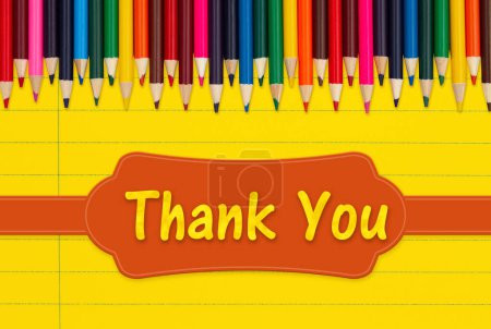Photo for Thank you message with color pencils crayons on vintage yellow ruled line notebook paper - Royalty Free Image