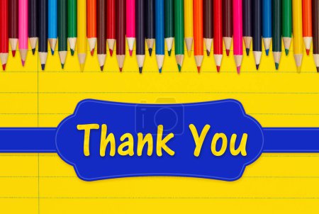 Photo for Thank you message with color pencils crayons on vintage yellow ruled line notebook paper - Royalty Free Image
