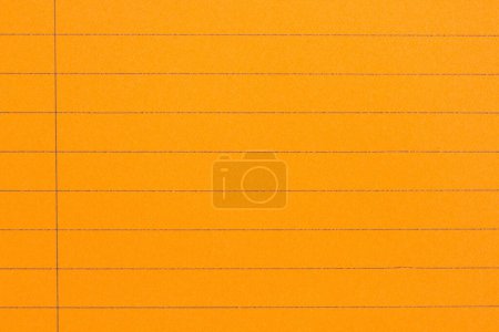 Foto de Fondo de papel de cuaderno de escuela forrado de naranja retro con espacio de copia para su mensaje escolar - Imagen libre de derechos