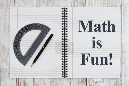Photo for Math is fun message with ruled line paper page notepad with pen and protractor - Royalty Free Image