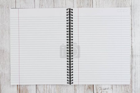 Foto de Ruled line journal paper page notepad background on weathered desk for writing or journaling - Imagen libre de derechos