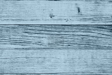 Foto de Fondo de madera granulada erosionada azul con textura de grano con espacio de copia para su mensaje o uso como textura - Imagen libre de derechos