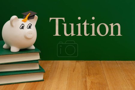 Photo for Saving money for tuition education with piggy bank, books, desk and chalkboard - Royalty Free Image