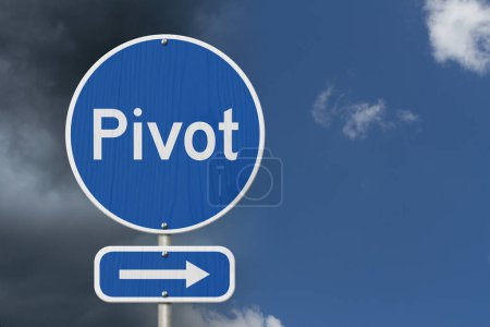 Photo for Pivot this way message on highway road sign isolated with stormy and sunny sky - Royalty Free Image