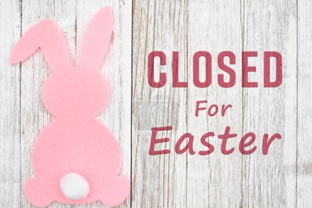 Closed for Eater sign with a pink bunny on weathered wood