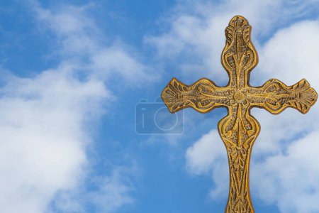 Photo for Gold detailed religious cross with sky - Royalty Free Image