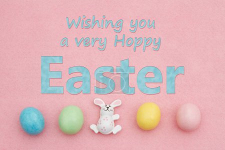  Happy Easter greeting wish with pale Easter with bunny rabbit egg on pink felt 