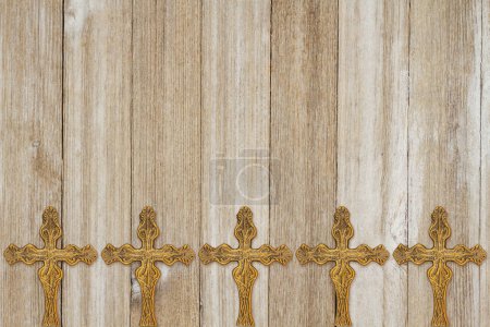 Photo for Gold detailed cross background on weathered wood - Royalty Free Image
