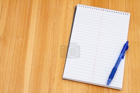 Photo for Retro old lined notepad and pen weathered desk for taking notes at school - Royalty Free Image