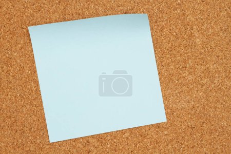 Photo for Brown corkboard blue sticky note background - Royalty Free Image