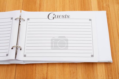 Retro old white and black guest book on a desk for a special occasion