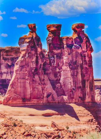 Photo for Three Gossips Red Orange Rock Formation Canyon Arches National Park Moab Utah USA Southwest. - Royalty Free Image
