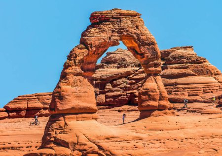 Photo for Delicate Arch Bicycle Red Orange Rock Canyon Arches National Park Moab Utah USA Southwest. - Royalty Free Image