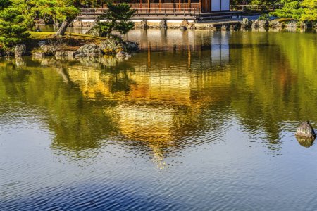 Photo for Kyoto, Japan - November 23, 2023 Colorful Water Reflection Garden Kinkaku-Ji Rokuon-Ji Golden Pavilion Zen Buddhist Temple Park Kyoto Japan. Dates to 1397 World Heritage Site. - Royalty Free Image