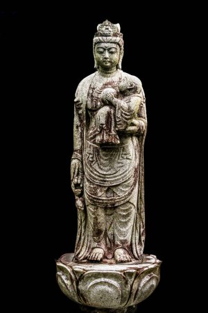 Female Mother Stone Buddha With Baby Tofuku-ji Zen Buddhist Temple Kyoto Japan. Statue of Guan Yin or Maria Kannon. Japanese pray at statue to ask for children. Temple dates to 1236. 