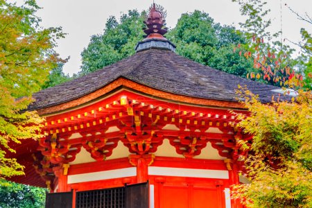 Coloful Red Small Budhist Temple Aizendo Raining Yellow Fall Leaves Green Trees Tofuku-ji Zen Buddhist Temple Kyoto Japan. Dates to 1236. 