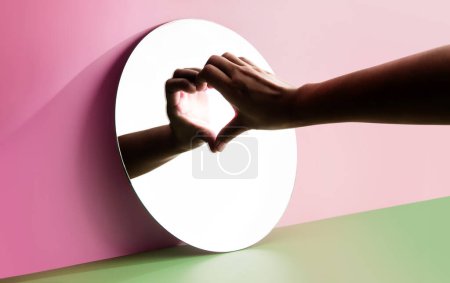 Photo for Conceptual Photo for Love and Relationship. Love Yourself. Single Person using Hand to Form a Heart Shape on the Mirror. Fill Yourself with Romance on Valentines Day - Royalty Free Image