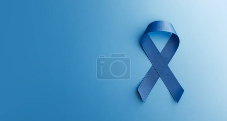 Photo for Prostate Cancer Awareness Campaign Concept. Men Healthcare. Close up of a Blue Ribbon Lying on blue background, Top View - Royalty Free Image