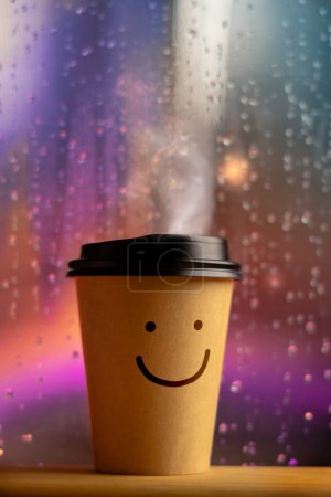 Photo for Enjoying the Harmony Life, Optimistic Mind Concept. Smiling Face on Coffee Cup. Happy Mood even if Bad Rainy Day. Serene, Balancing Mind, Soul and Spirit. Mental Health Practice - Royalty Free Image
