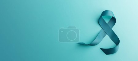 Photo for Ovarian and Cervical Cancer Awareness. a Teal Ribbonin Top View position, Uterus, Female Reproductive System, Women's Health, PCOS and Gynecology - Royalty Free Image