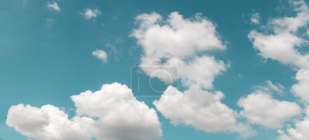 Photo for Clouds in the Blue Sky on Sunny Day, Nature Scenery with a Good Weather. Looking Up Shot. Long and Wide Screen - Royalty Free Image