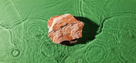 Photo for Top View of a Stone Display Stand for Product. lay on Green Freshness Smooth Water Ripple. Background for Environmental and Sustainable Products - Royalty Free Image