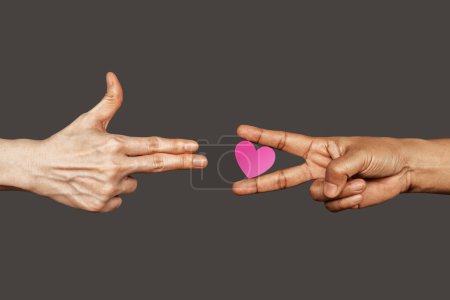 Photo for Stop War with Love, Peace Concept. Love always Win. a Finger Gun Gesture on left, right is a Victory Peace Hand Sign with Heart shape.World International Peace Day - Royalty Free Image